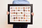Person holding framed Boobs puzzle artwork.