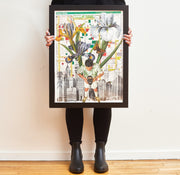 Person holding a frame with the completed Theater District puzzle.