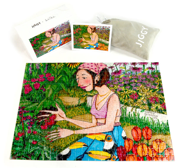 Completed Secret Garden puzzle with box, insert card and puzzle bag