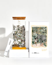 Jungle Afternoons Puzzle box with reusable glass jar, tube of puzzle glue and straight-edge tool to spread the glue.
